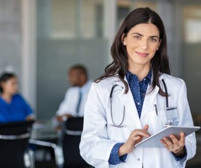 Doctor holding digital tablet at meeting room fractional leadership for medical practice growth