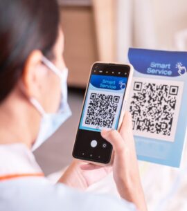 Patient woman using smartphone scan qr codes to connect a doctor to health Information Patient woman using smartphone scan qr codes to connect a doctor to health Information