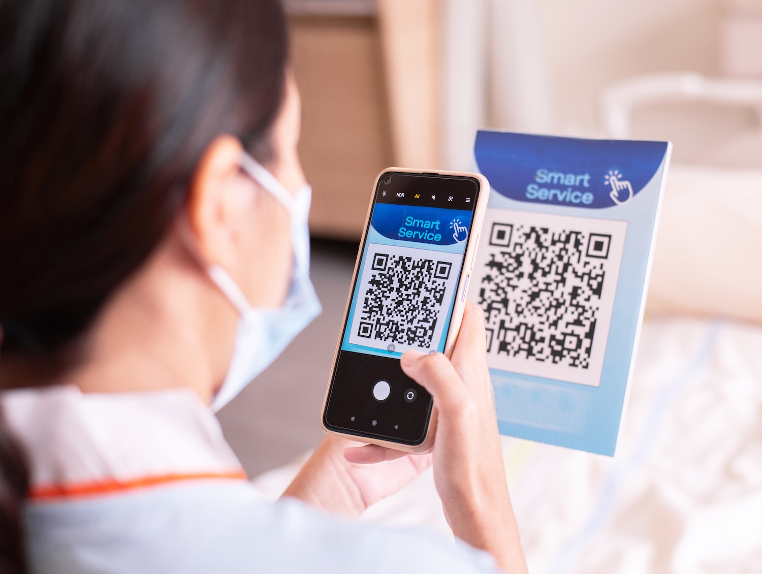 Patient woman using smartphone scan qr codes to connect a doctor to health Information Patient woman using smartphone scan qr codes to connect a doctor to health Information